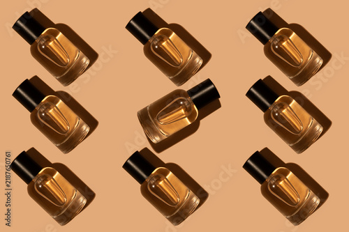 Pattern. A bottle of women's perfume with a black shadow.