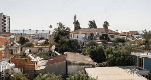 A view from a window onto the rooftops of houses in old historical district of Larnaca in Cyprus