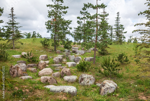 Glacial boulders resting upon a grassy hill