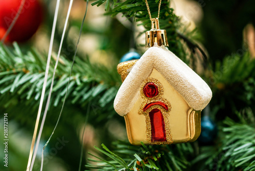 Christmas House Ornament Symbolizing Home and Real Estate