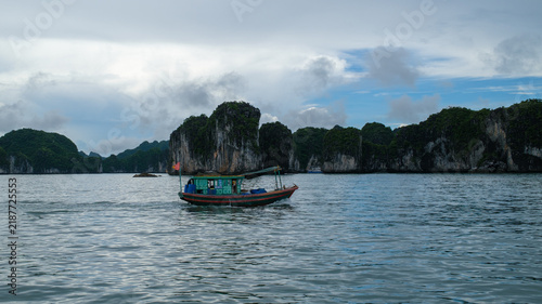 Traditional Boat Sailing Among Limestone Karsts in Ha Long Bay, Vietnam
