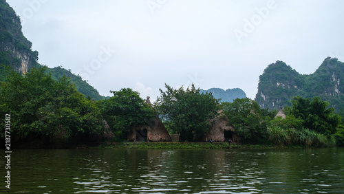 Traditional Thatched Huts in Trang An Karst Landscape, Vietnam
