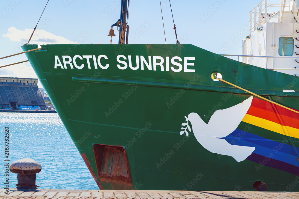 Obraz premium Burgas, Bulgaria - September 07, 2026: Bow of Greenpeace Arctic Sunrise with peace dove graphic. Bow of Greenpeace research vessel with ship name, white peace dove, multicolored hull graphic at port
