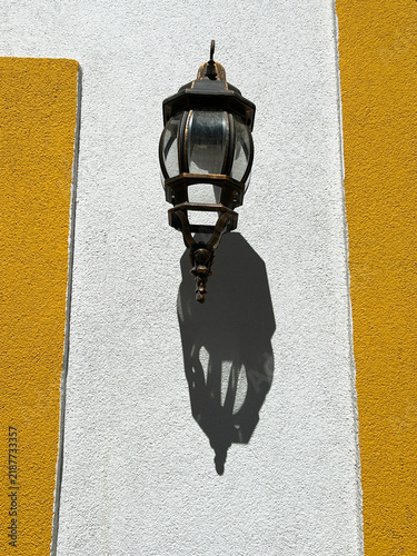 Vintage-style outdoor wall light on the facade of the old house. Lagos. Portugal.