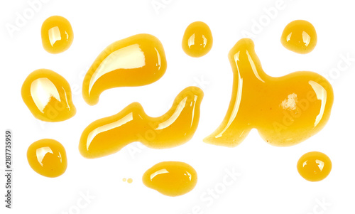 Spilled drops of fresh apple and peach juice isolated on white background, top view