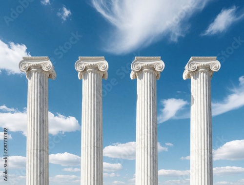 Four tall white Ionic columns stand against a bright blue sky. These pillars represent strength  support  law  and stability in classical architecture.
