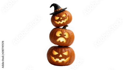Fotografie Three carved Halloween pumpkins stacked one wearing a witch hat, isolated on tra