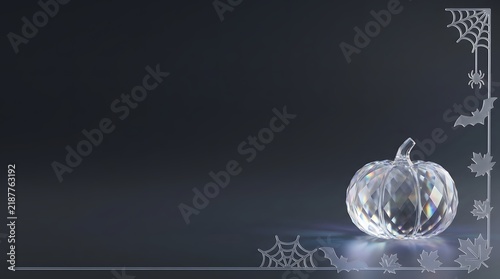 Glass pumpkin for Halloween on dark spooky background