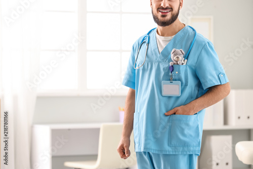 Male pediatrician with toy in his pocket at hospital