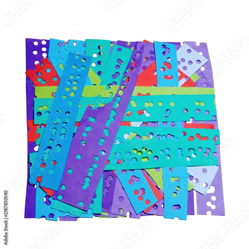 Cuadro en lienzo A vibrant, chaotic pile of numerous colorful paper strips, each with punched cir