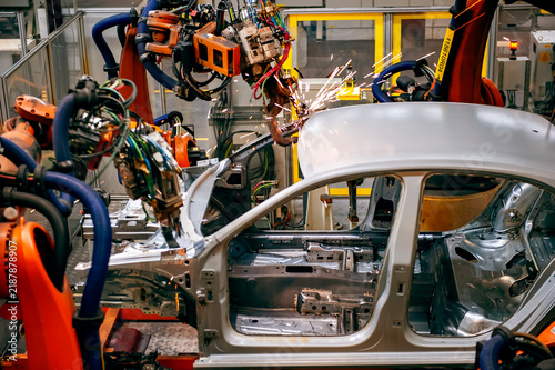 Automotive industry robotic arm assembly line