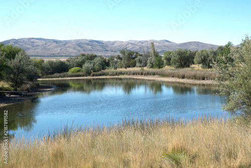 lake in the mountains, serenity in the mountains, a quiet pond, a still serene pond