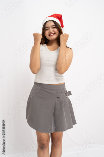 Принти на полотні Excited Young Woman Wearing A Festive Hat Celebrating Success Isolated On A Whit