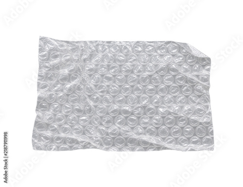 Connected clear air pillow packing filler strip with several inflated rectangular chambers, coherent seams and a slight natural bend.
