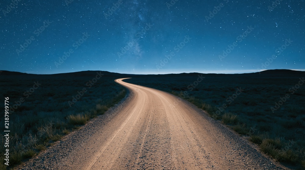 Obraz premium Winding dirt road under starry night sky landscape