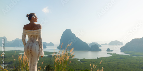 Woman in Lace Dress at Samet Nangshe Viewpoint During Sunrise