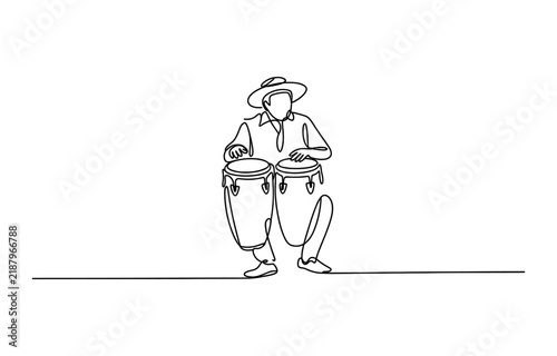 Foto Continuous single line drawing of a musician playing conga drums wearing a hat