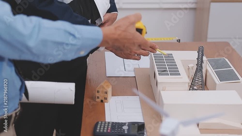 Close-up Of Person's engineer Hand Drawing Plan On Blue Print with architect equipment, Architects discussing at the table, team work and work flow construction concept