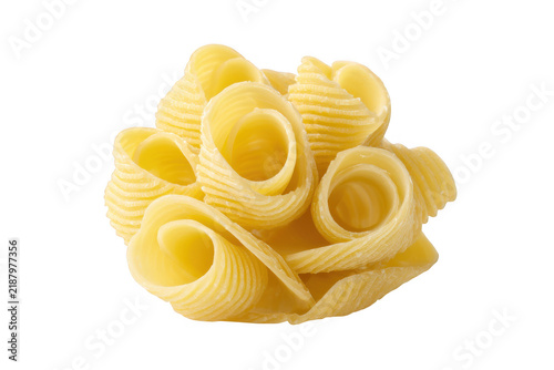 Yellow butter curls shaped into a flower-like cluster, isolated on a solid black background, showing ribbed texture and soft dairy edges
