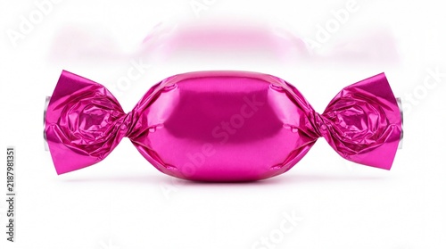 Single pink wrapped candy on a bright surface