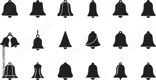A collection of eighteen different black silhouette bell icons isolated on a white background representing various shapes and styles of ringing hand bells