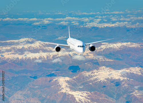 Photography An airplane flying over a snowy taurus mountain range, with snow-capped peaks vi