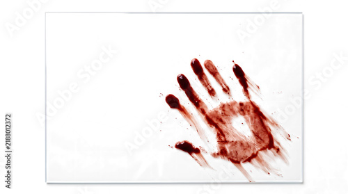 Фотография Bloody handprint sliding across a glass pane with dragged fingertip trails and s