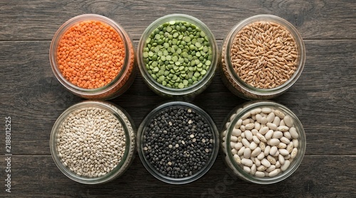 Assorted grains and legumes in glass jars