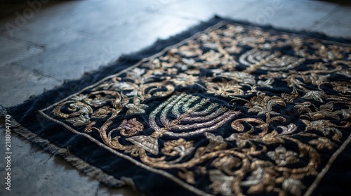 Embroidered menorah textile on stone floor