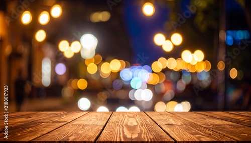 Wooden table, blurred bokeh background background. Neon light, night view, close-up. The general background of the interior, a dark background.