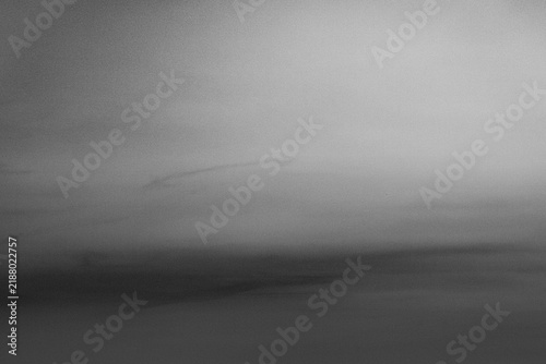 Misty Distant Bridge Fading Into Fog Over Water in Monochrome