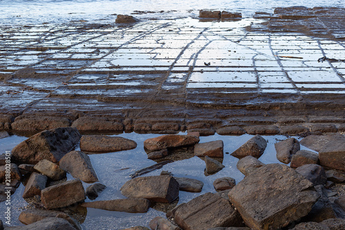 Tessellated pavement at Eaglehawk Neck, Tasmania, illustrating the pan formation of tessellation