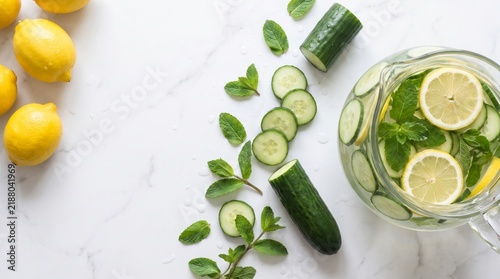 Detox Cucumber Lemon and Mint Water Pitcher on White Marble with Copy Space