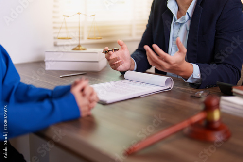 Lawyer explaining contract terms to client in office meeting for legal advice concept