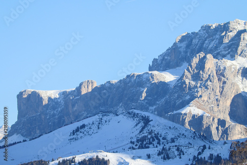 Photography Snow-covered limestone cliffs and alpine ridges dominate this detailed winter vi