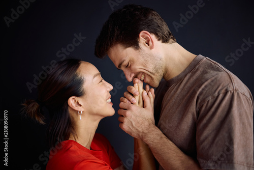 Obraz na plátně Happy couple in love enjoying in affectionate moments at home.