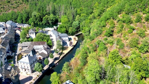 September 10, 2026 - Aerial descending shot of the picturesque village of Esch-sur-Sûre in Luxembourg, nestled in a lush river valley.