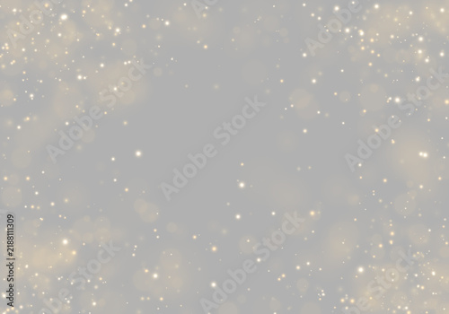Fotografie Golden sparkling particles scattered across a dark background create a dynamic bokeh effect