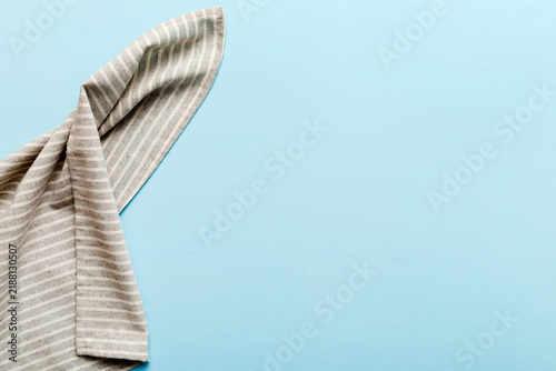 Obraz na płótnie top view with gray kitchen napkin isolated on table background