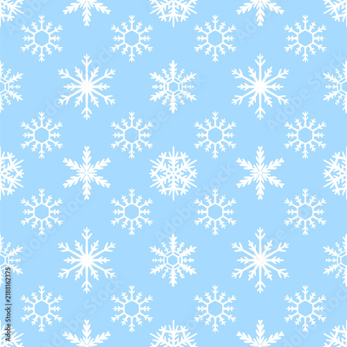 Seamless Winter Pattern with White Snowflakes on Light Blue Background for Holiday Decor