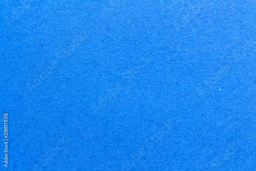blue paper background texture light rough textured spotted blank copy space background in blue
