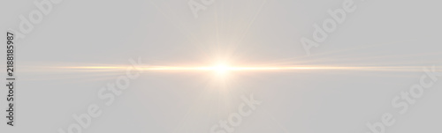 A radiant orange light burst spreads horizontally across a black background. The luminous flare creates a dramatic and intense glow with streaks of light extending outward in multiple.
