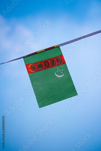 Картината върху платно Turkmenistan national flag waving in the wind, representing Turkmenistan Independence Day, national pride and national identity