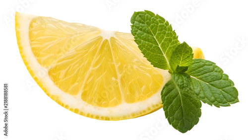 A juicy lemon wedge with fresh green mint leaves isolated on transparent background for summer food design