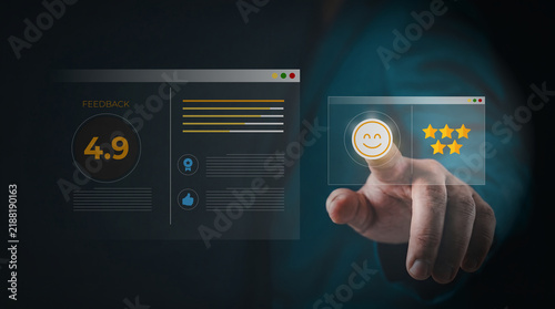 Business person touching a virtual screen with positive customer satisfaction feedback and star ratings