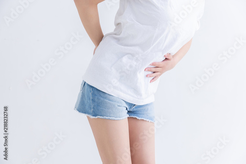 Obraz w ramie 腰痛を訴える女性