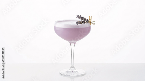 Lavender cocktail with foam and garnish in coupe glass, studio shot