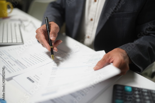 Business Professional Reviewing and Signing Financial Documents