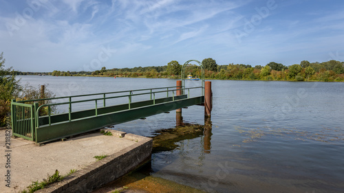 A ferry crosses the River Maas to transport tourists and schoolchildren to the other side, in the province of Limburg, the Netherlands.