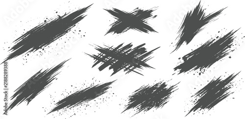 Set of Dark Brush Strokes and Splatters: A collection of rough, hand-drawn brush strokes and scattered paint splatters in dark gray tones, offering a grungy.